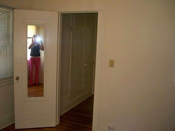 Bedroom, large storage cupboards in hall