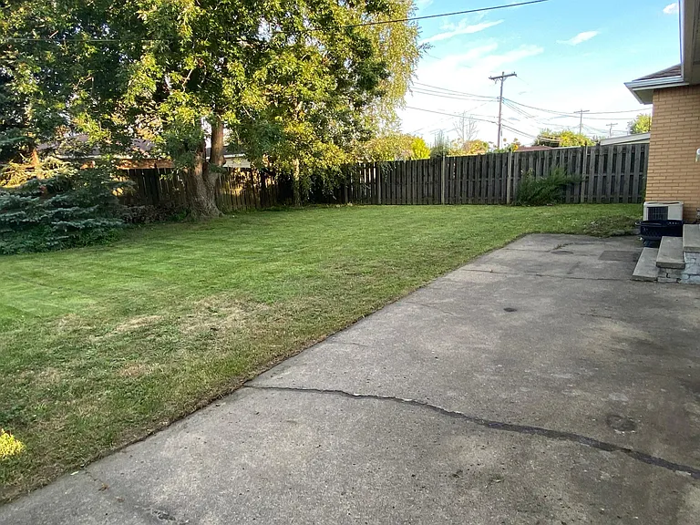 Backyard with large concrete patio