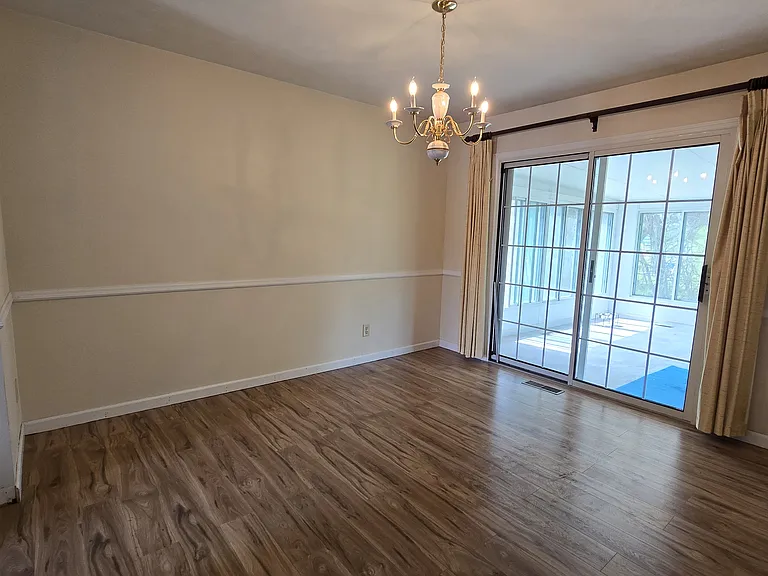 formal dining room view of sun room