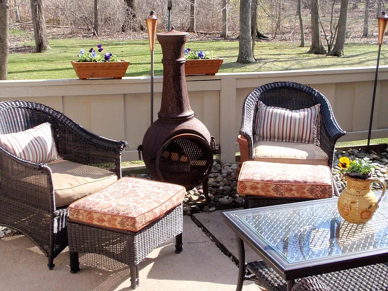 View of patio enclosure looking out toward wooded lot.