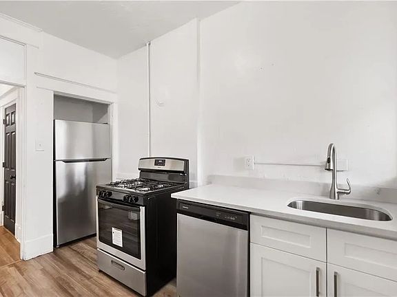 Kitchen with stainless steel refrigerator, stove and dishwasher