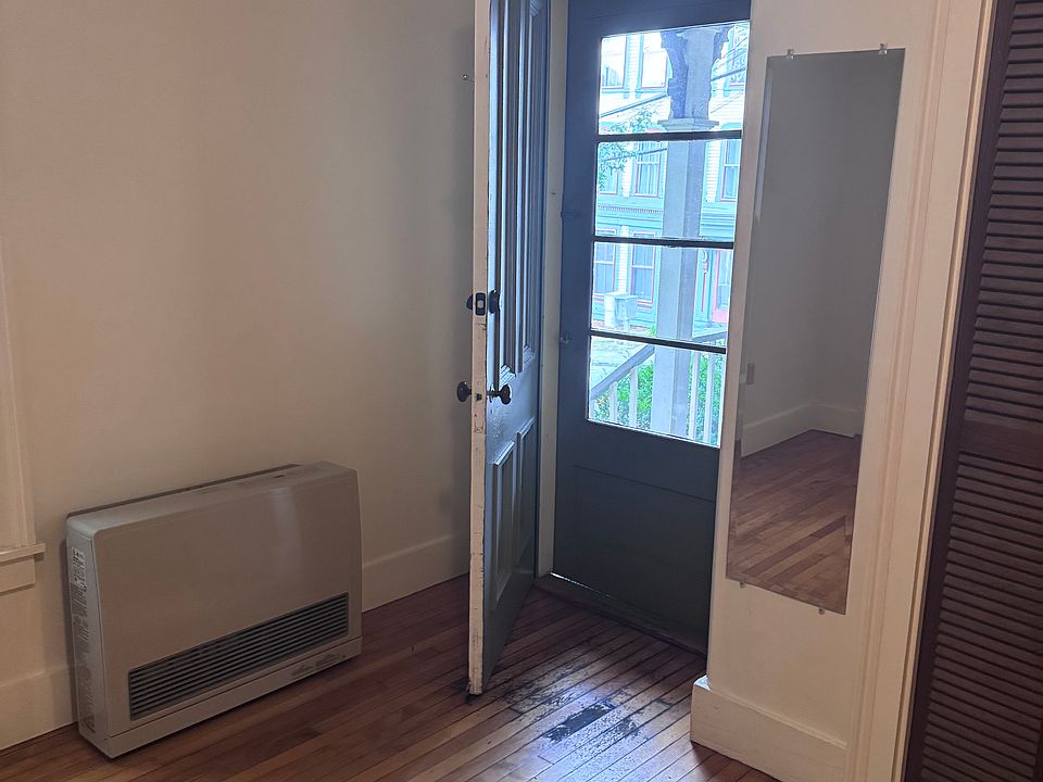 Entry from side porch. Enters into bedroom.
