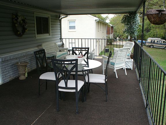 Large covered deck that over looks the pool. Great for Summer time parties!