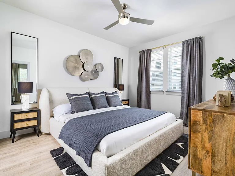 Unwind in comfort and style with Modera Georgetown's spacious bedrooms featuring large custom closets designed to accommodate your bed.