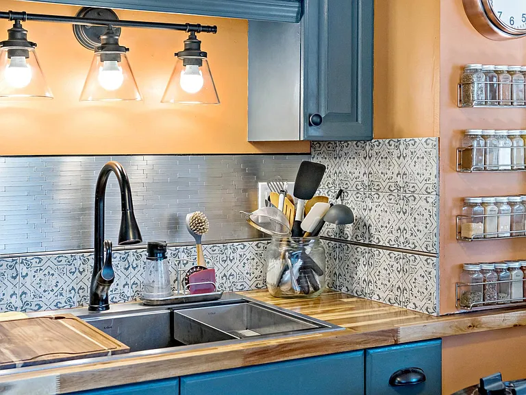 Brand new acacia countertops, Kraus workstation sink (with cutting board and colander) and high-end tile