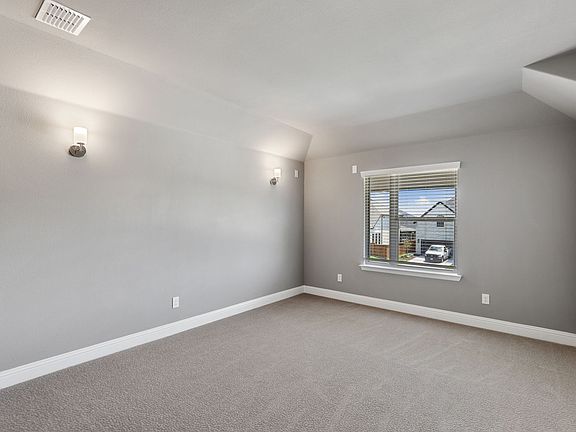 Media room in the Van Gogh home plan by Trophy Signature Homes - REPRESENTATIVE PHOTO