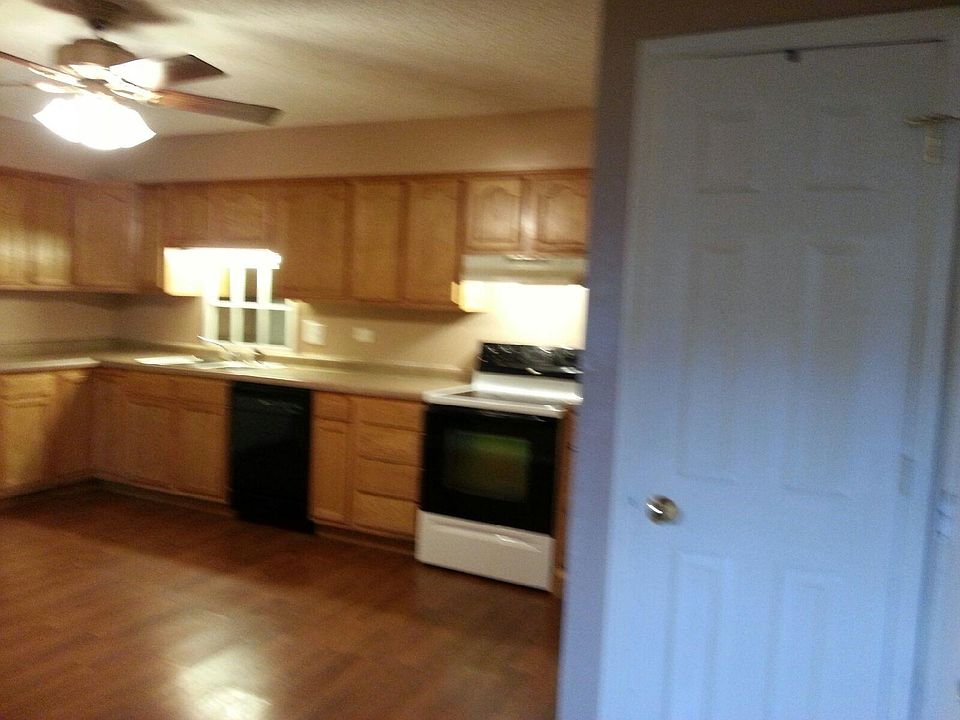 Kitchen has lots of newer cabinets/counters, stainless steel double sink, Door on the right is a coat CLOSET, which is next to the condo entry door.