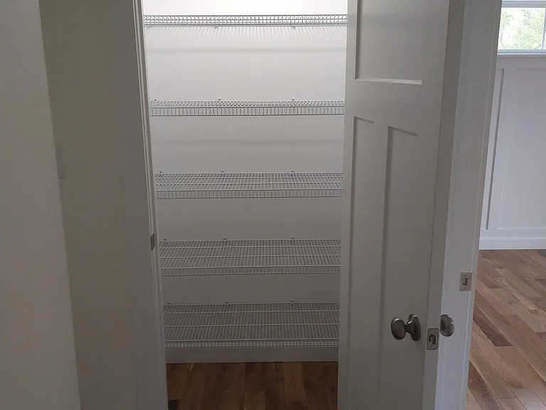 hallway linen closet and bedroom