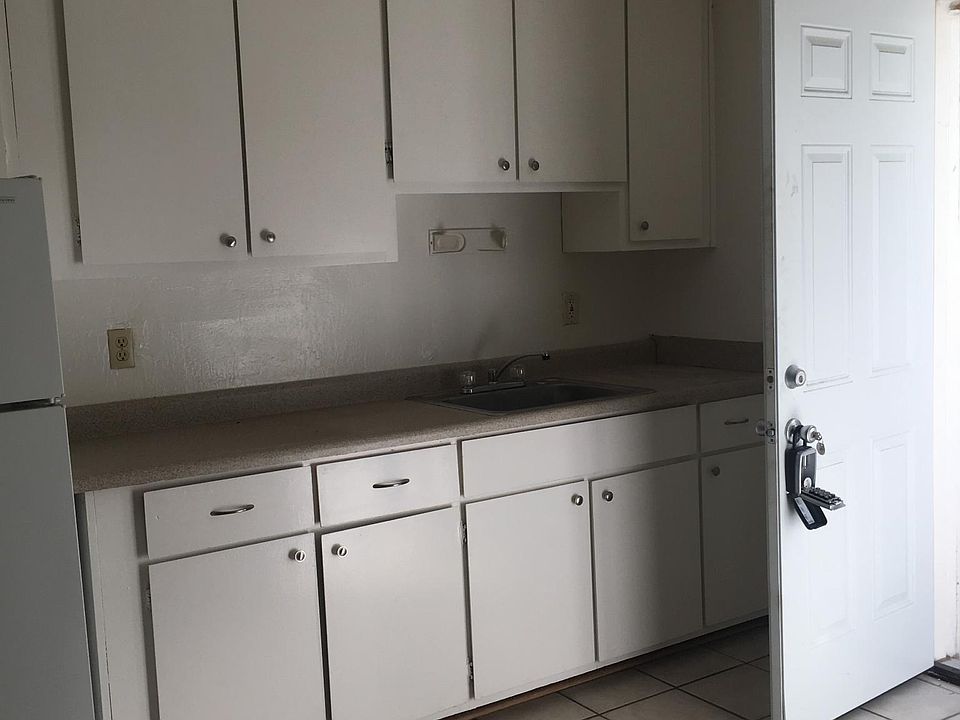 Kitchen with door to side yard