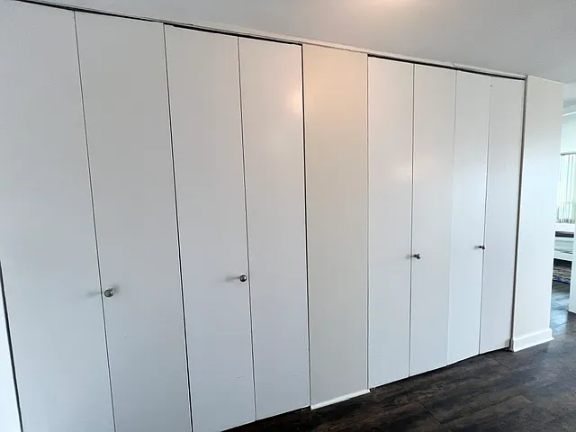 Hallway with a wall of closet