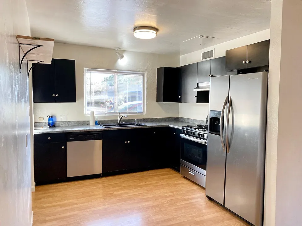Gas range, dishwasher, garbage disposal and large refrigerator/freezer included