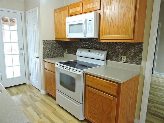 Kitchen has a large pantry by the French door for food or storage.