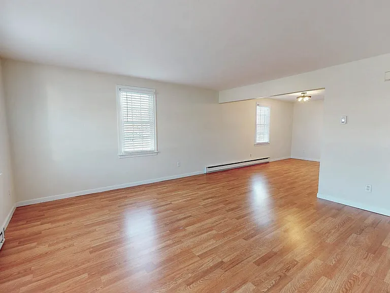 Designer luxury vinyl plank flooring with bright open floor-plan.