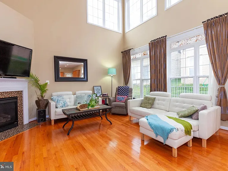 Great Room/ Family Room with 19' cathdral ceiling, lots of windows to let in natural light