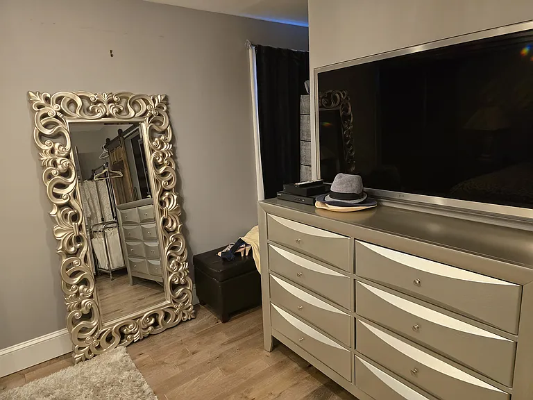 ANOTHER VIEW OF BEDROOM. IT HAS A HUGE WALK IN CLOSET & LG. SCREEN SMART TV.