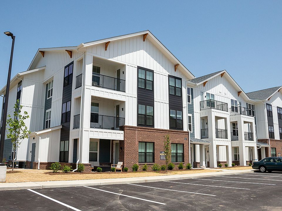 Nese Apartments feature interior stairwells and hallways, as well as private patios or balconies.