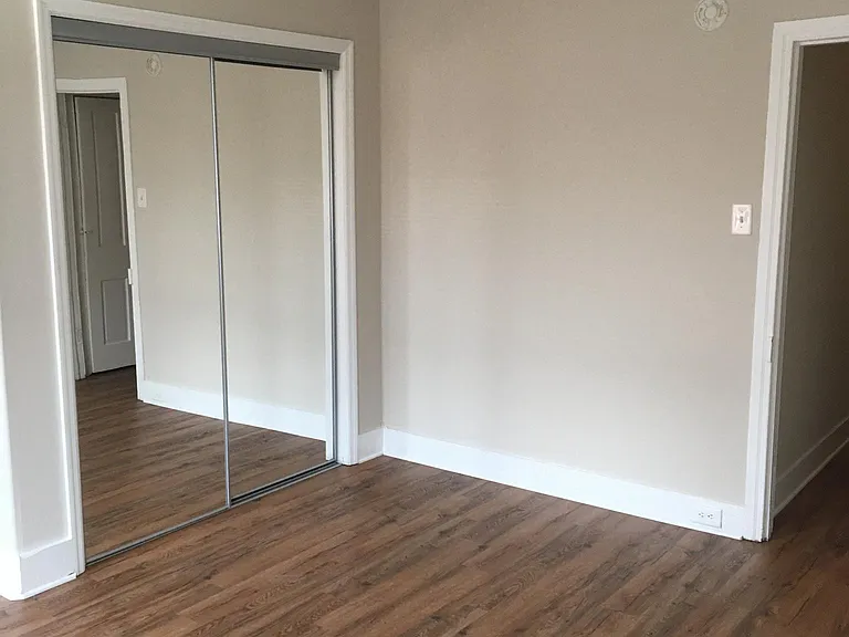 Master bedroom with two windows and 2 closets