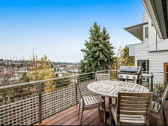 Deck with outdoor table, chairs, gas grill and views, views, views.