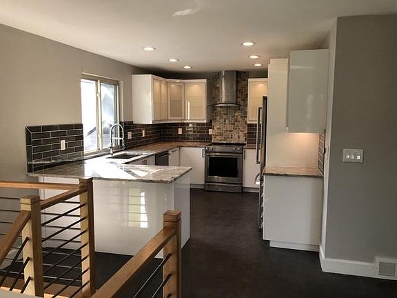 Very functional kitchen that was recently updated with new appliances, new cabinets, and granite countertops.