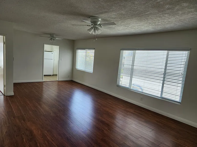 Huge living room with lots of light! A/C unit newly installed.