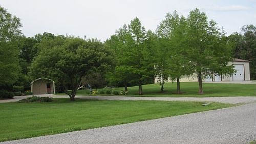 wide angle of side yard and pole barn