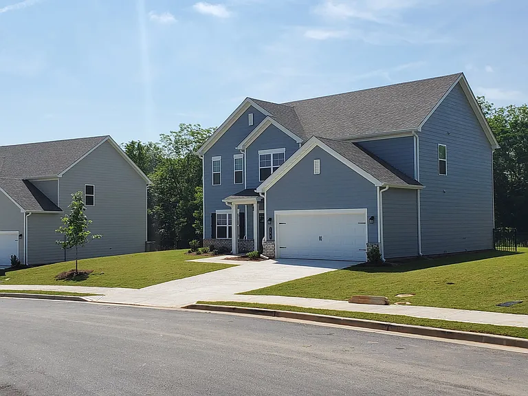 Southwind exterior: two-story homes with private driveways and attached garages.