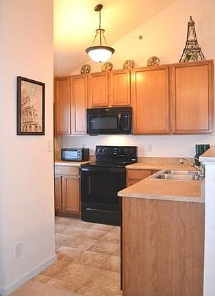 Vaulted ceiling and beautiful cabinetry with lots of counter space!