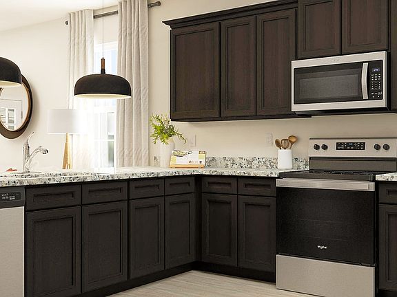 The open kitchen and family room in the Maple are perfect for gathering larger groups.