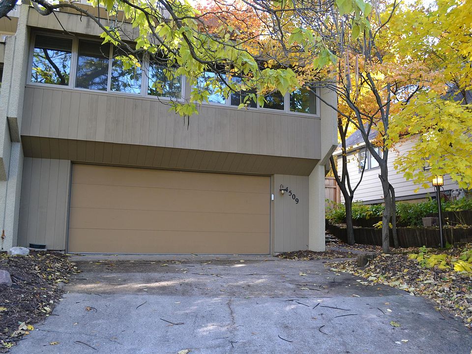 4509 Ewing Ave S; side-by-side duplex with attached 2 car garage (photo from fall 2019)