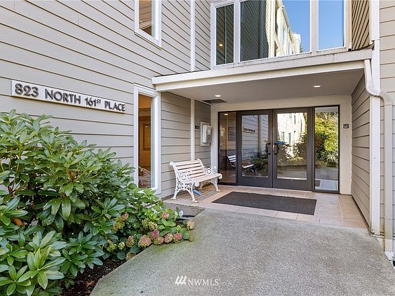 Top floor end unit overlooking natural setting.