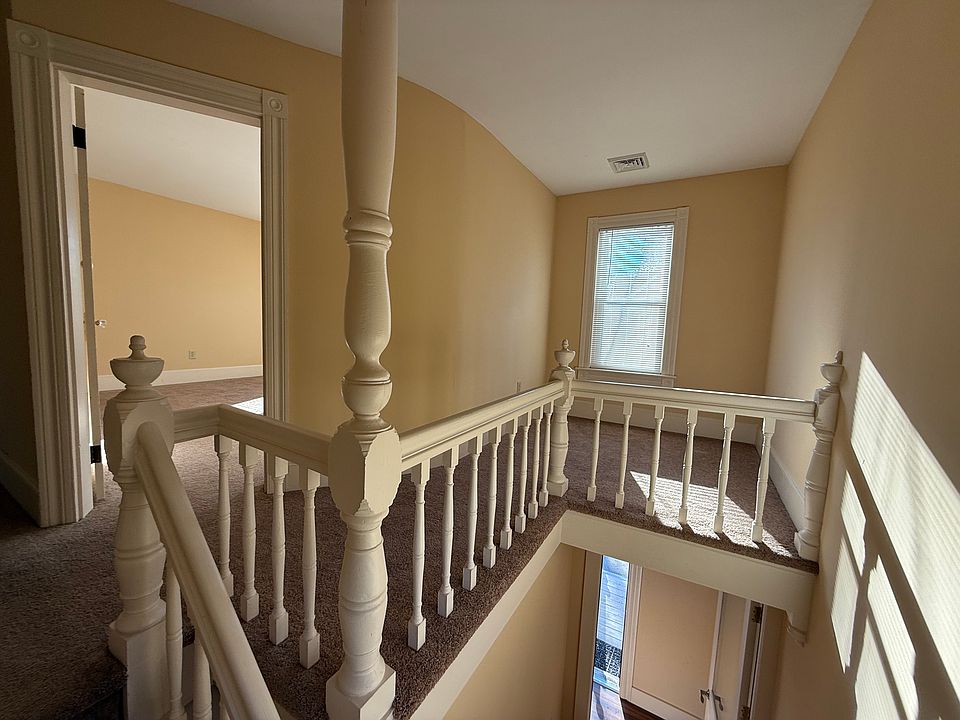 Beautiful baluster and handrail detail, cute landing with large window. Great for a good book.