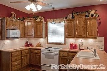 Kitchen w/ bar sink eat on counter
						:
						The ceiling fan light shows microwave on Left, easy to see whats cooking inside.