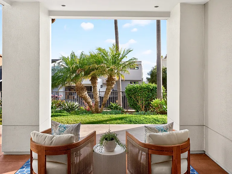 Covered patio with partial ocean view