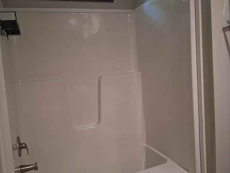 Tub/shower combo with plenty of room to move around.