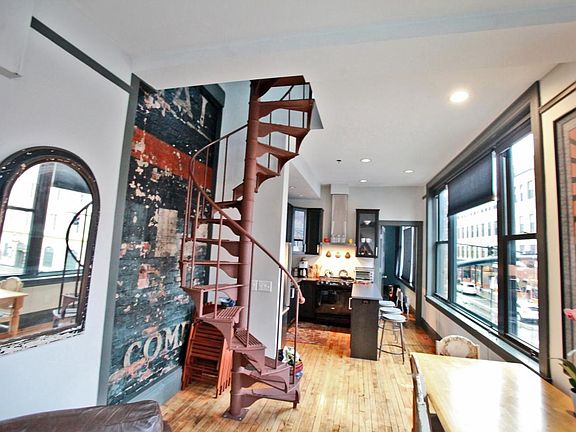 vintage advertising mural, spiral staircase and view from li