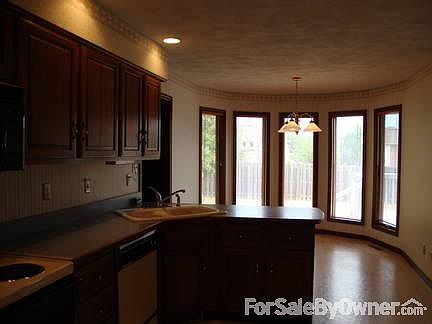 Kitchen
						:
						Looking toward bay windows of eat-in kitchen, which overlooks back yard.