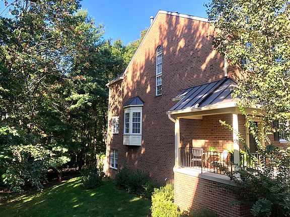 Loads of windows sunny and warm on every level. Wooded rear yard and deck.