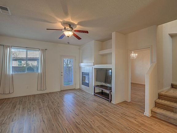 Living room with gas fireplace and TV niche