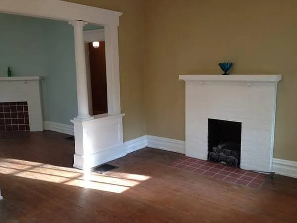 fireplace in living room looking into dining room