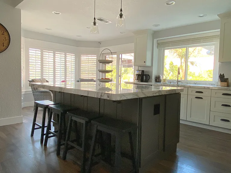 Gather around the spacious kitchen island_perfect for morning coffee, meal prep, or sharing laughs over dinner. A stylish and functional centerpiece in the heart of the home.