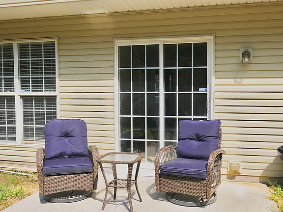 Relax outside with this huge fenced + private backyard.