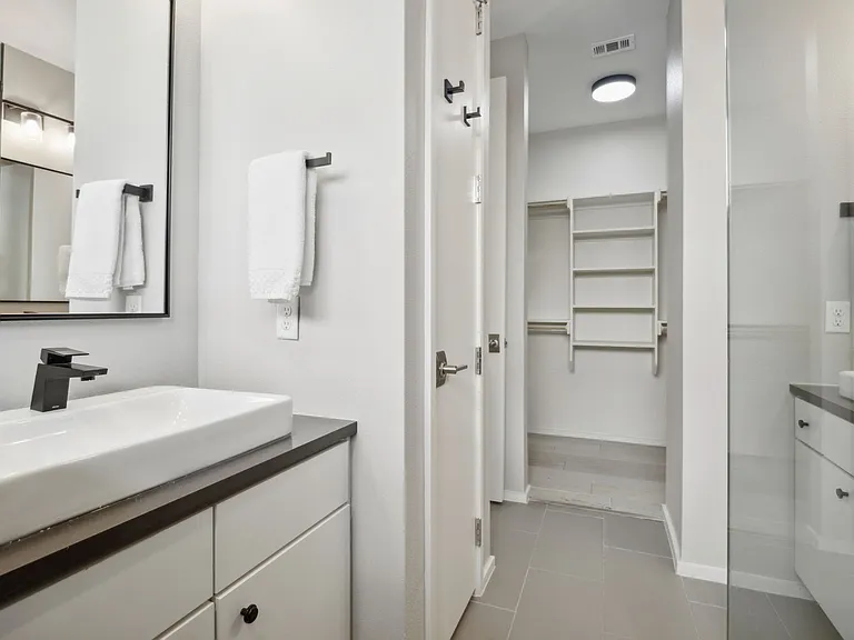 Master Bath and closet with built in shelves