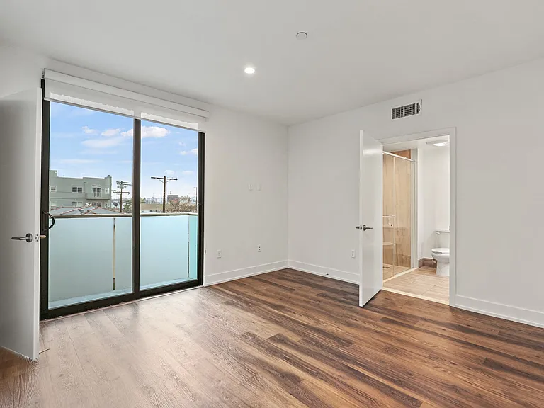 Bedroom with Bathroom, Closet, and Balcony