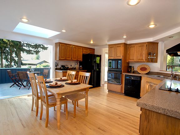Gracious French doors and large skylight floods the kitchen with light.