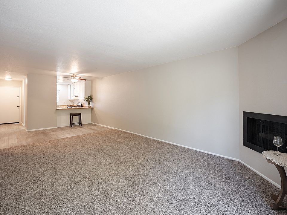 Living room with fireplace and kitchen