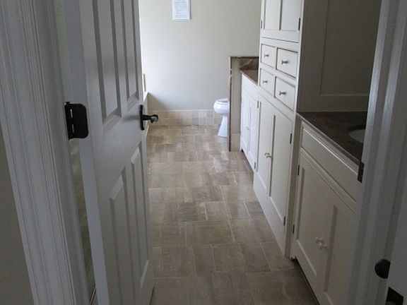 Full Bath with Double Vanity and Built-i Shelving