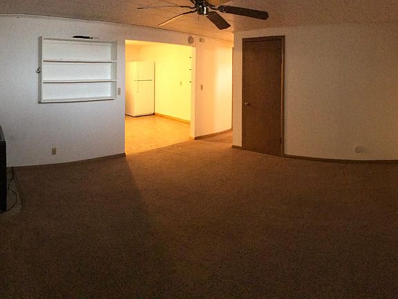 Living room looking towards kitchen and hall.