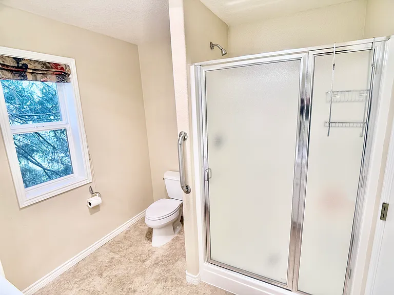 Frosted glass walk-in shower.