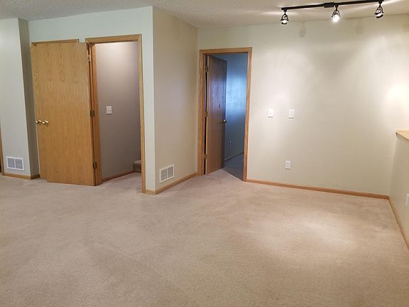 Part of the family room just down a short flight of steps. One bedroom on this end