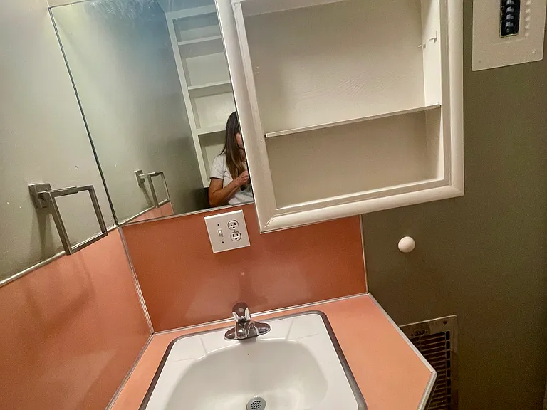 Bathroom with shower and wall heater